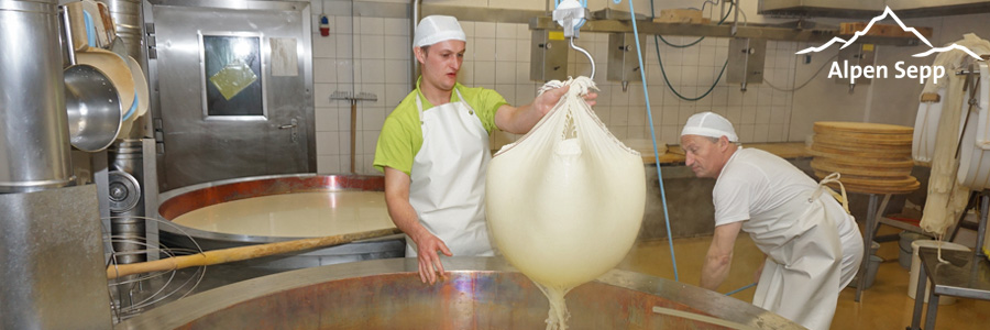 Christoph and Hermann removing the cheese curd